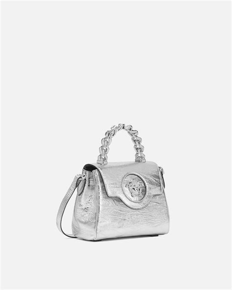 silver versace bag|Versace gold chain bag.